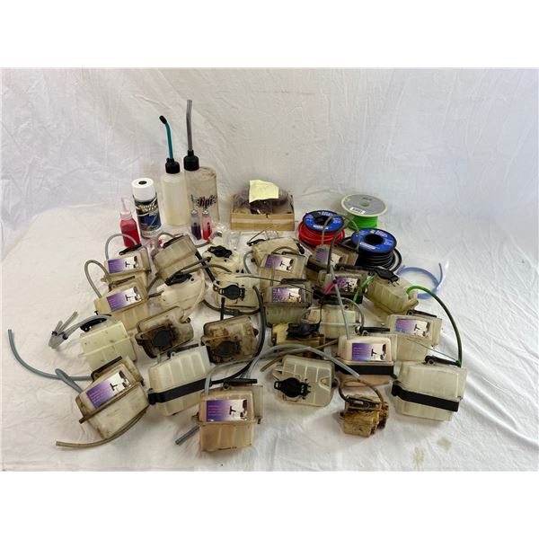 Lot of fuel tanks, cables and car parts