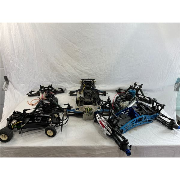 5 partially assembled RC parts cars