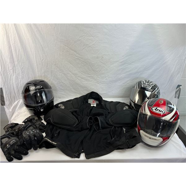 Three motorcycle helmets and riding jacket