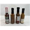 Image 2 : Four mixed unopened bottles of hot sauce