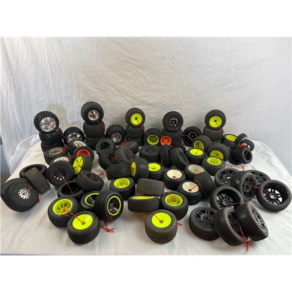 large lot of RC car tires on rims