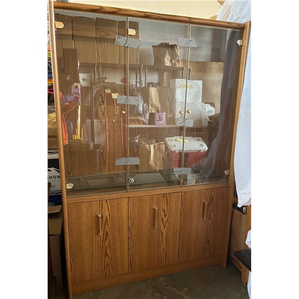 Glass front cabinet with 3 lower doors