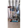 Image 1 : GARDEN IMPLIMENT RACK FULL OF GARDENING TOOLS: AXE, SHOVEL, RAKE, EDGE TRIMMER, BROOM PSI