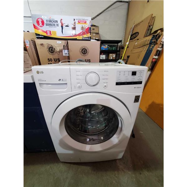 LG Direct Drive true balance front load washing machine - floor model display with manuals