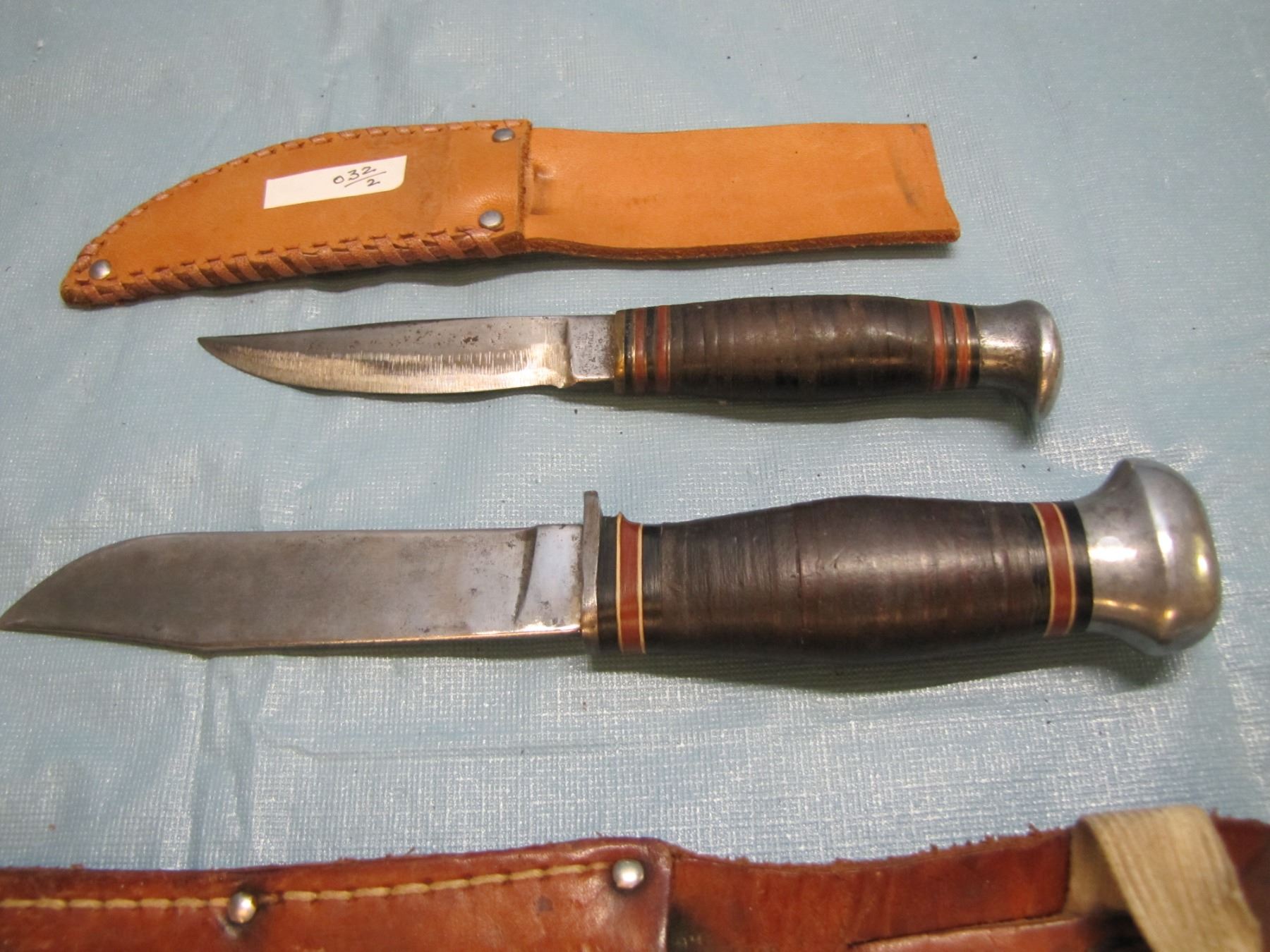 2 WWII era hunting/ Bowie knives and scabbards ; 1 Sheffield ; 1 pal