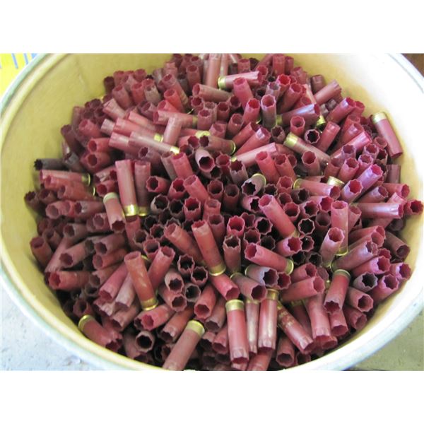 Lot of 12 gauge shotgun shell hulls in a paper barrel 36 inches tall by 21 inches round