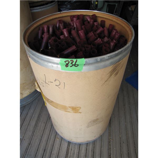 Lot of 12 gauge shotgun shell hulls in a paper barrel 24 inches tall by 15 inches round