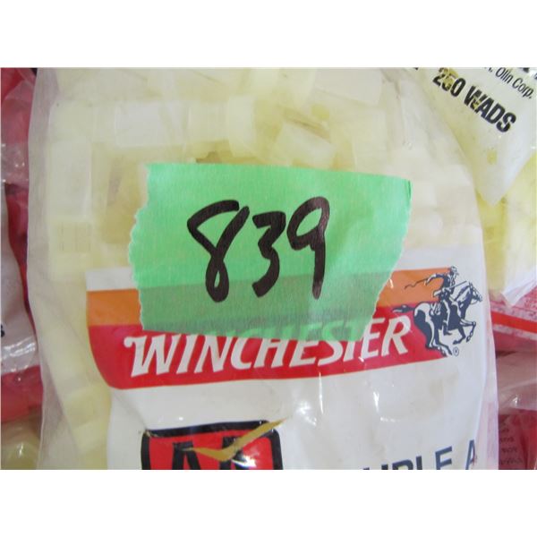 Bag of mostly 12 gauge shot shell wads ; Estimate size to be about half of a 45 gallon drum