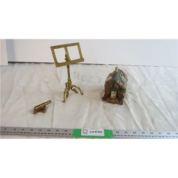 Rock Cabin with metal cannon and stand