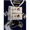 Image 2 : 2 CANUCKS JERSEYS WITH TABLE TOP FOOSBALL GAME WRISTBANDS AND EMBLEM