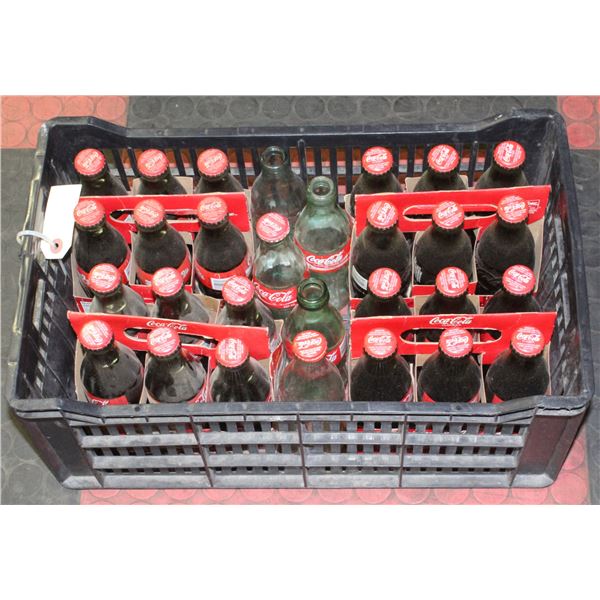 PLASTIC CASE OF VINTAGE GLASS COLA BOTTLES