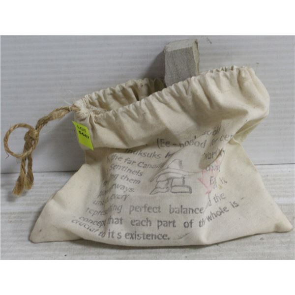 DISMANTLED INUKSUK IN BAG