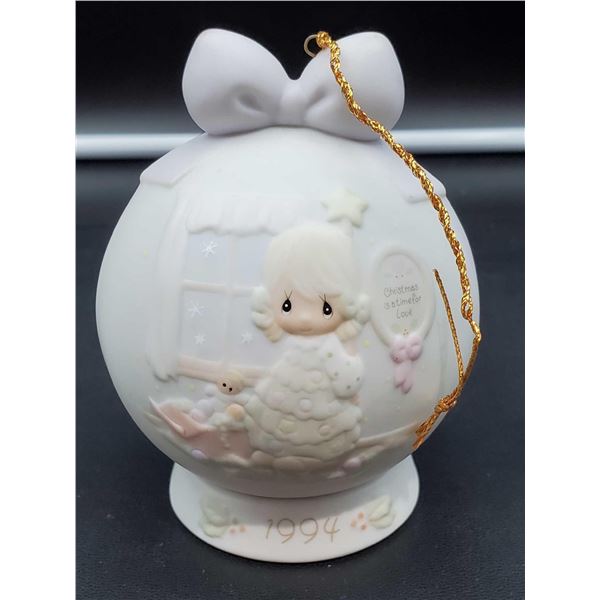 The Precious Moments collection Christmas ornament with stand