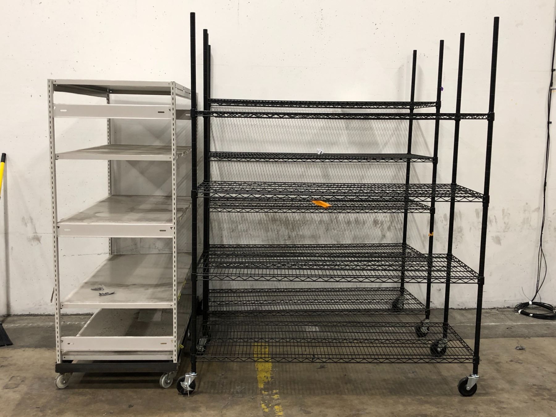 Group of 3 commercial heavy-duty rolling shelves (black shelving approx ...