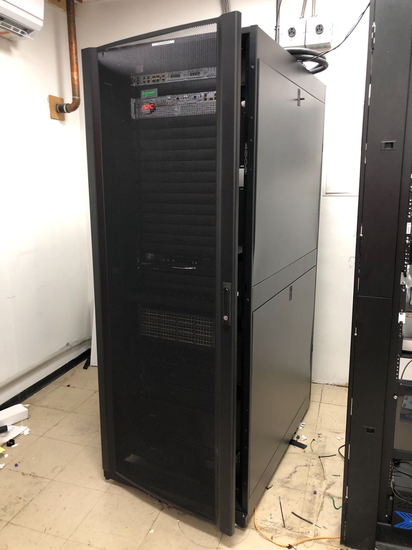 Server room rolling server rack w/ voice & data router/ APC battery ...