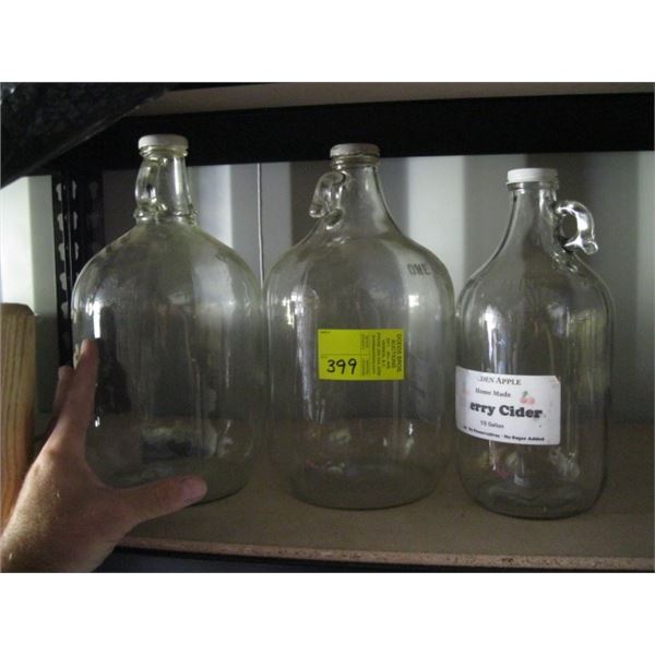 3 GLASS JUGS & A CONTAINER W/COLLANDER, ETC.