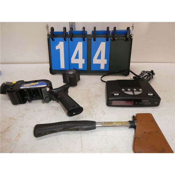 alarm clock, tape gun, hatchet