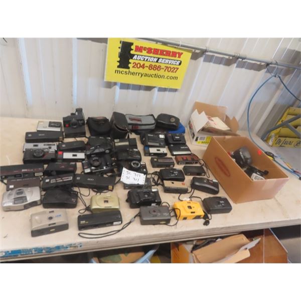 38 Cameras ; Canon, Kodak, Polaroid, Concord, Vivitar plus others , also with Flash Bulbs, Flash Acc