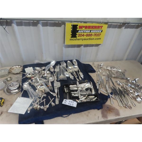 Quantity of Flatware + Utensils - Plated - I believe - don't have time to look at each item