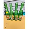 Image 1 : Four 7 oz 7-UP bottles, two with bathing suit girl