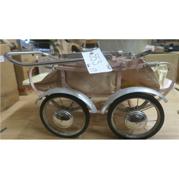 Vintage toy pink pull buggy