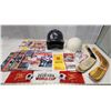 Image 1 : Huge lot of Sports Magazines, Memorabilia, Hockey sticks and assorted helmets/hardhat
