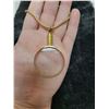 Image 2 : Magnifying loupe on a gold tone chain