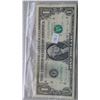 Image 1 : 5 USA $1 bills ( 1988, 1995(2), 2009, 1935) in plastic bag