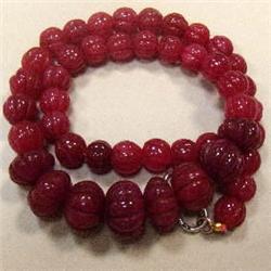 475 CTS CARVED GLASS FILLED ENHANCED RUBY STRAND - TEMPORARY CLASP