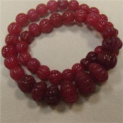470 CTS CARVED GLASS FILLED ENHANCED RUBY STRAND - TEMPORARY CLASP
