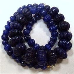 530 CTS CARVED GLASS FILLED ENHANCED SAPPHIRE STRAND - TEMPORARY CLASP