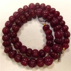 415 CTS CARVED GLASS FILLED ENHANCED RUBY STRAND - TEMPORARY CLASP