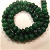 Image 1 : 600 CTS CARVED GLASS FILLED ENHANCED EMERALD STRAND - TEMPORARY CLASP