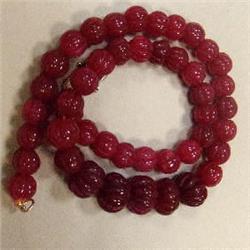 430 CTS CARVED GLASS FILLED ENHANCED RUBY STRAND - TEMPORARY CLASP