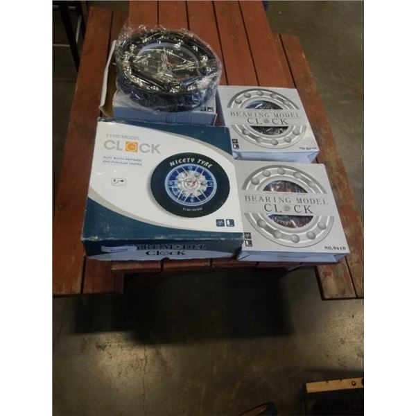 4 NEW BEARING WALL CLOCKS AND TIRE WALL CLOCK