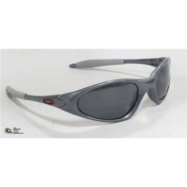 PAIR OF GREY OAKLEY REPLICA SUNGLASSES