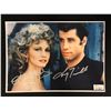 Image 1 : OLIVIA NEWTON JOHN AND JOHN TRAVOLTA SIGNED GREASE 8 X 10 (RA COA)