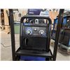 Image 2 : MILLERMATIC 211 MIG WELDER WITH RUNNING GEAR/CYLINDER RACK, GROUND CABLES, GUN AND WELDING HELMET