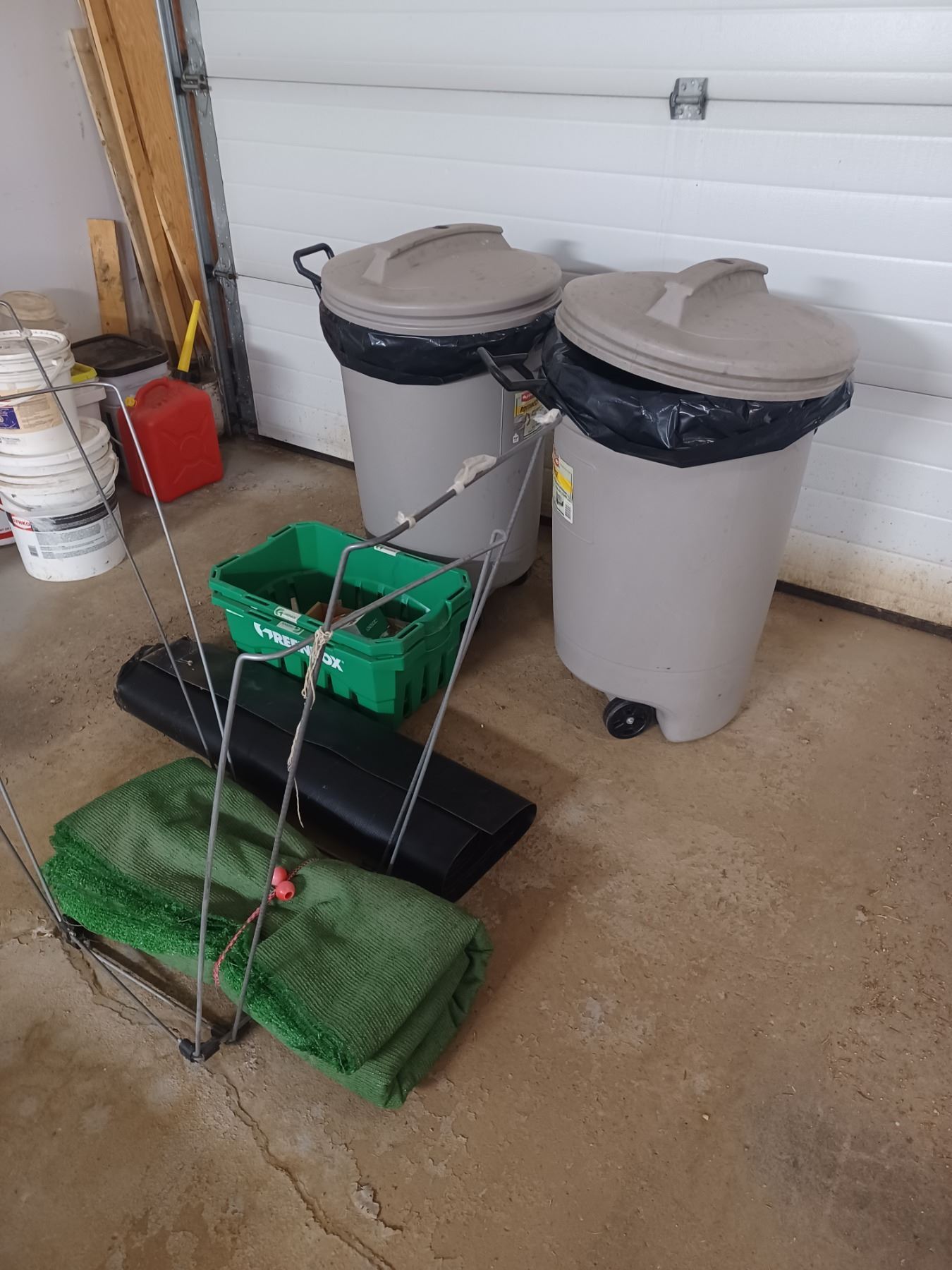 TWO YARD BAG HOLDERS, CHUNK OF ASTRA TURF, FLOOR MAT, TWO GARBAGE CANS ...