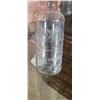 Image 2 : THREE GLASS BOTTLES (TWO SMIRNOFF AND ONE BROWN BOTTE- UNKNOWN) CANDLE HOLDER. PLEASE SEE IMAGES FOR