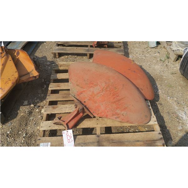 pallet with 2 med clam style tractor fenders.