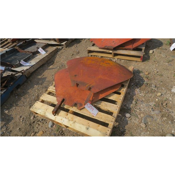 pallet with 2 med clam style tractor fenders.