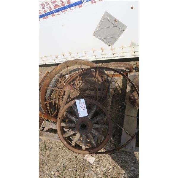 pallet with misc. antique metal tractor wheels.