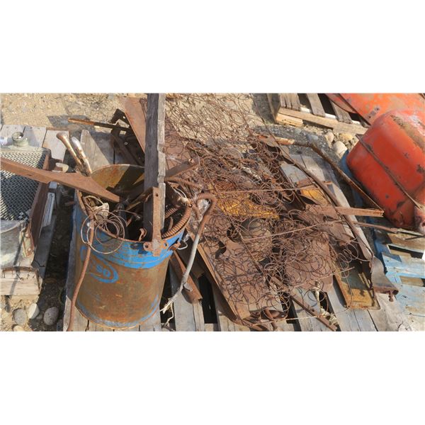 pallet of Ford model A or T parts, seat springs, bucket of misc. parts, frame parts.