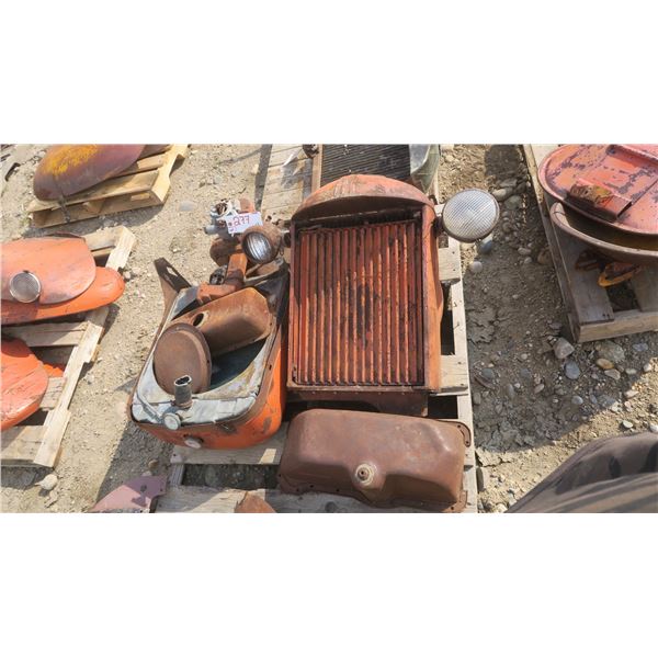Pallet of misc. antique Case tractor rads x2, exhaust manifold with carb, misc. parts.