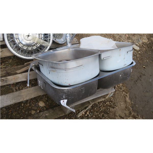 2  stainless steel double sinks, one with taps