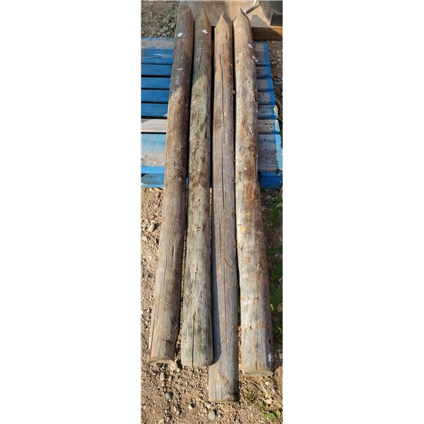 four 8 foot treated fence posts (used)