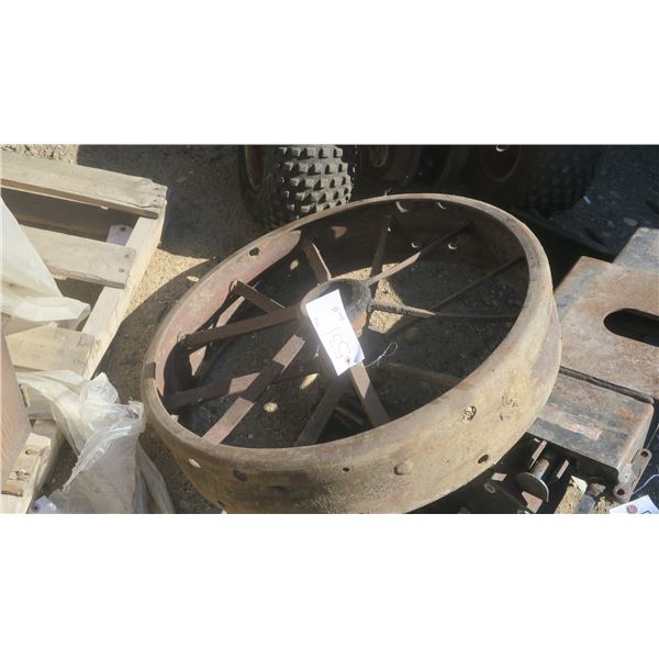 Older metal tractor wheel.