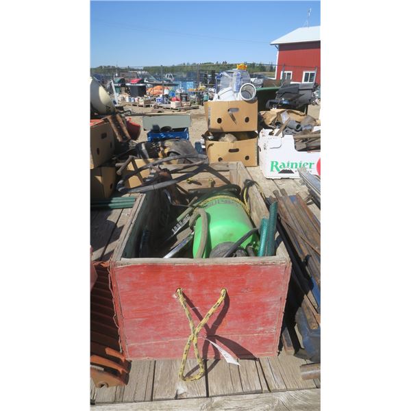 Red wood box with misc. items , Sprayer, emblems, steering wheel.
