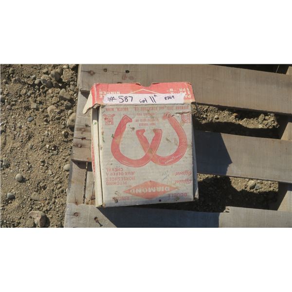 Set of pitching horse shoes in box